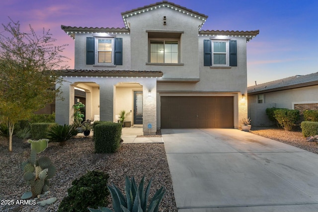 mediterranean / spanish-style home featuring a garage