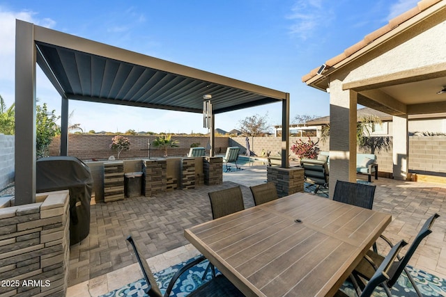 view of patio / terrace with a bar and a grill