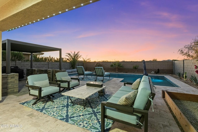 exterior space featuring an outdoor living space, a patio area, and grilling area