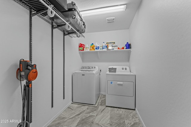 laundry area with separate washer and dryer