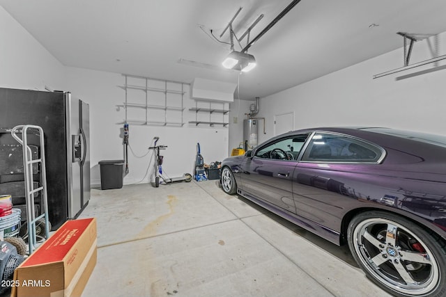 garage featuring stainless steel fridge, gas water heater, and a garage door opener