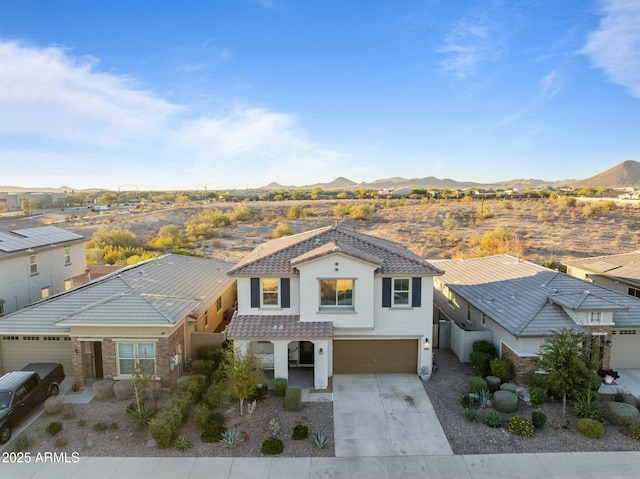 view of front of house featuring a mountain view and a garage