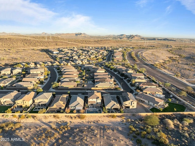 birds eye view of property with a mountain view