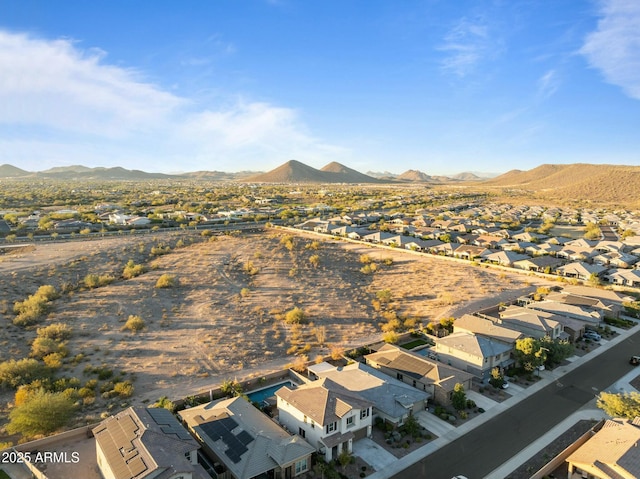 birds eye view of property with a mountain view