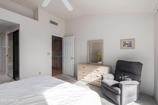 carpeted bedroom with ceiling fan and lofted ceiling