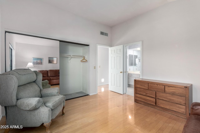 living area with light hardwood / wood-style flooring