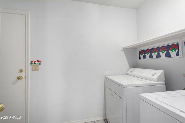 clothes washing area featuring washing machine and clothes dryer