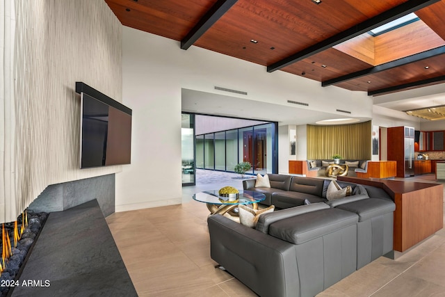 living room featuring beamed ceiling and wooden ceiling