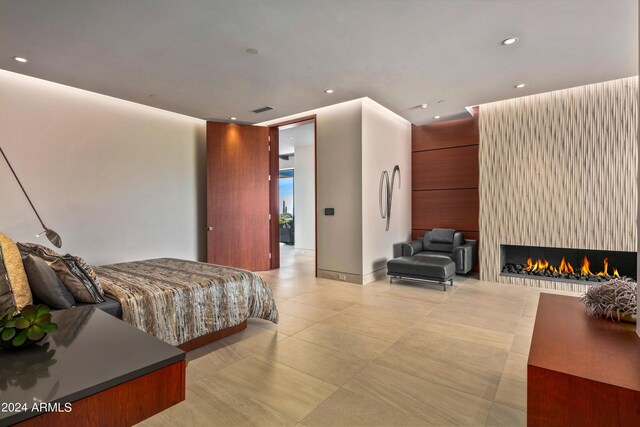 tiled bedroom with a fireplace