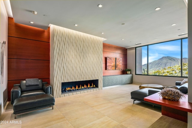 interior space featuring a mountain view and a large fireplace