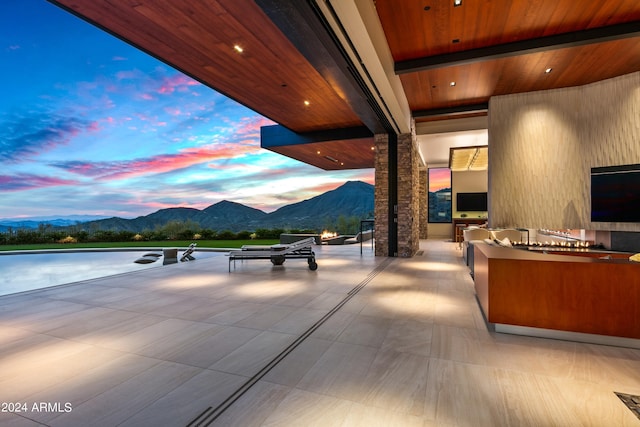 view of patio terrace at dusk