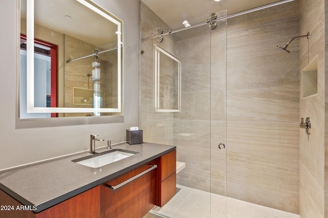 bathroom with a shower with door, vanity, and toilet