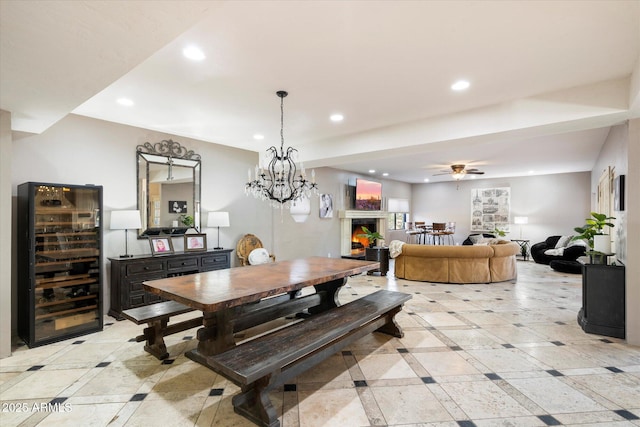 dining space with ceiling fan and beverage cooler