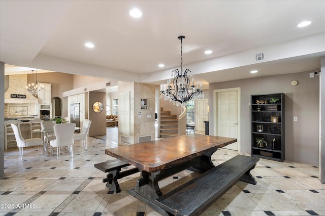 dining space with an inviting chandelier