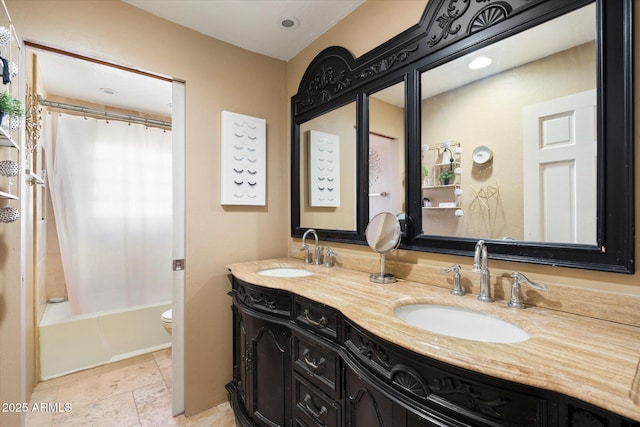 full bathroom featuring vanity, toilet, and shower / tub combo