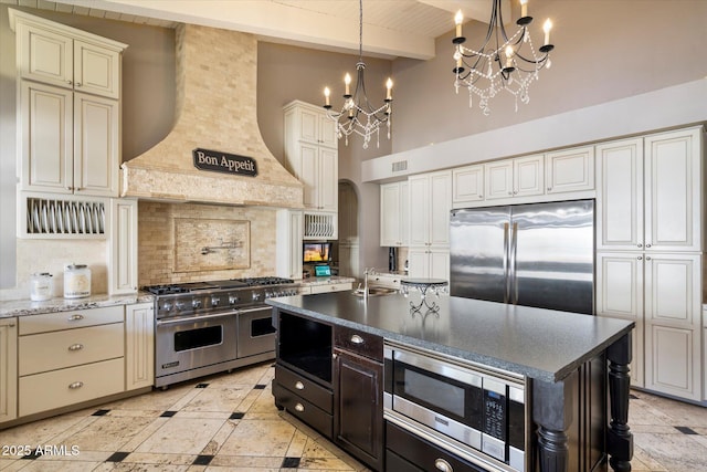 kitchen featuring premium range hood, backsplash, beam ceiling, high end appliances, and decorative light fixtures