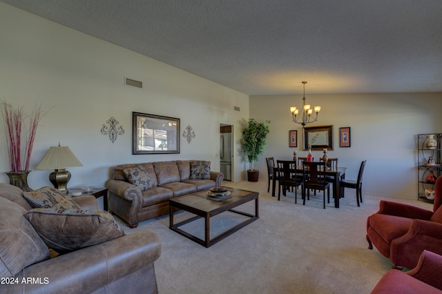 carpeted living room featuring a chandelier, a textured ceiling, and vaulted ceiling