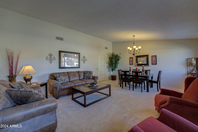 carpeted living room with a textured ceiling and an inviting chandelier