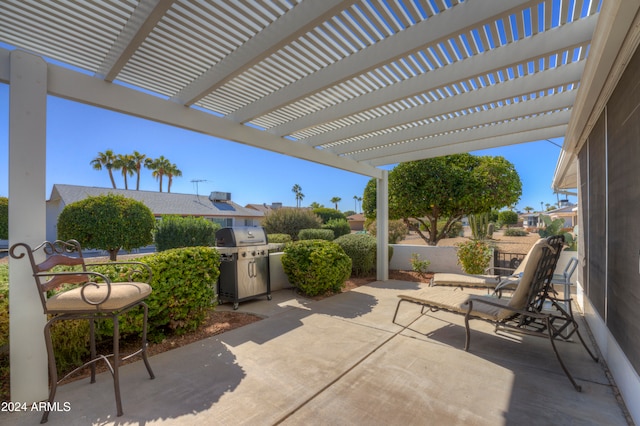 view of patio / terrace with a pergola and a grill