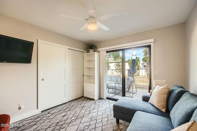 living area featuring ceiling fan