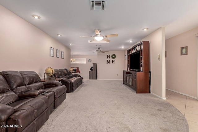 carpeted living room featuring ceiling fan