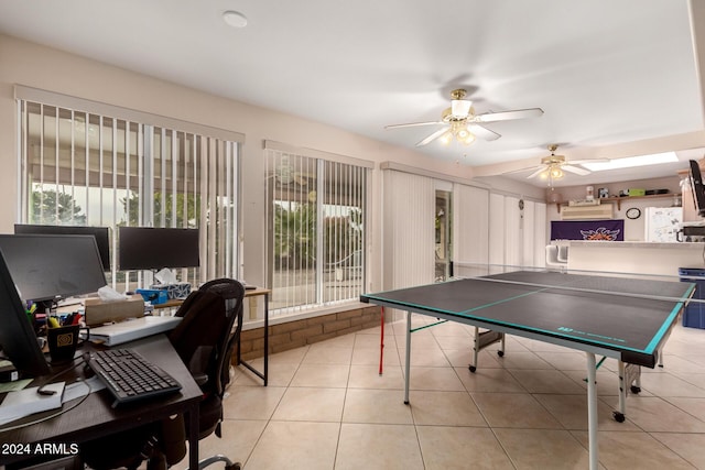 game room with ceiling fan and light tile patterned flooring