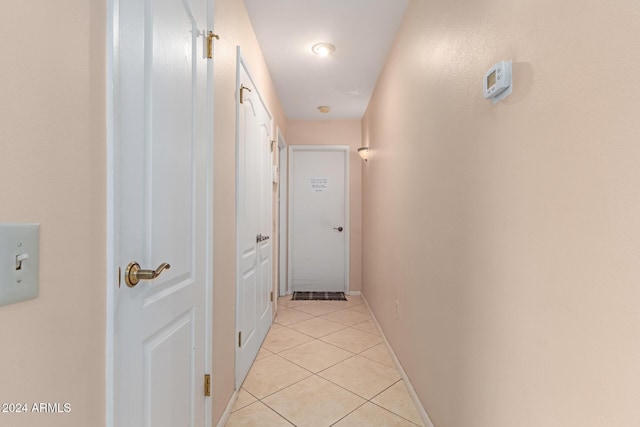 corridor with light tile patterned floors