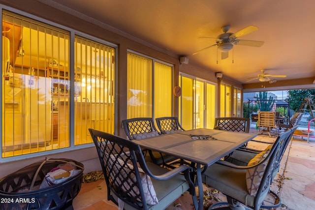 sunroom with ceiling fan