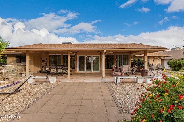 rear view of house featuring a patio