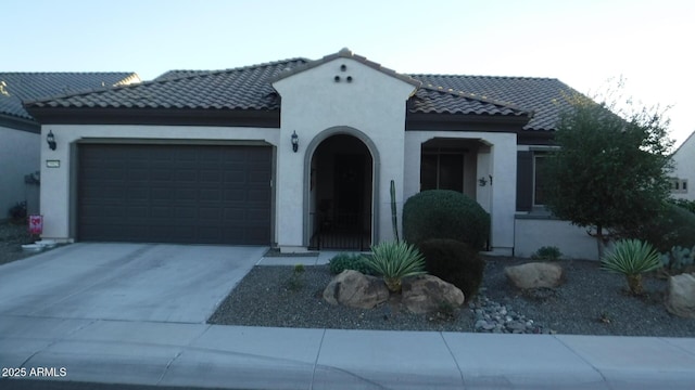 mediterranean / spanish-style home featuring a garage