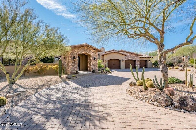 mediterranean / spanish house featuring a garage