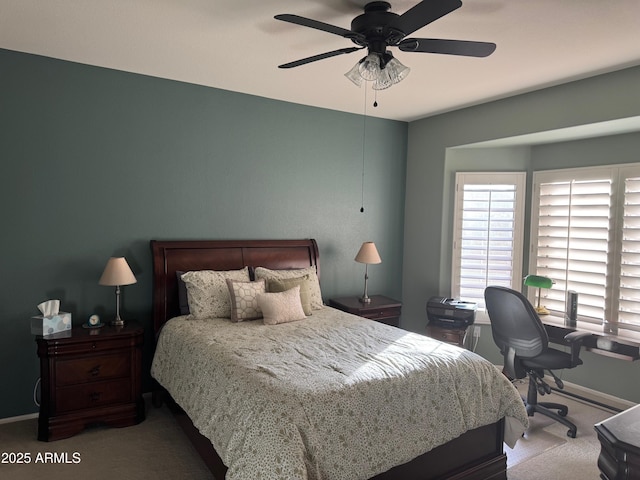 bedroom with baseboards, a ceiling fan, and carpet