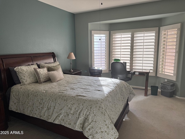 carpeted bedroom with baseboards