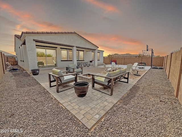 view of patio featuring a fenced backyard and a fire pit