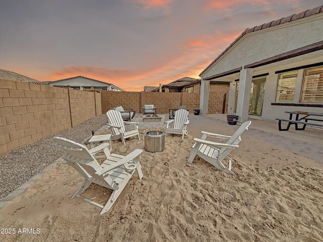 view of yard with an outdoor fire pit, a patio area, and a fenced backyard