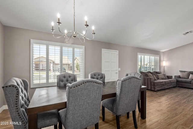 821 E Chicago St, Chandler, AZ 85225 - dining room featuring a notable chandelier, light wood-type flooring, and visible vents