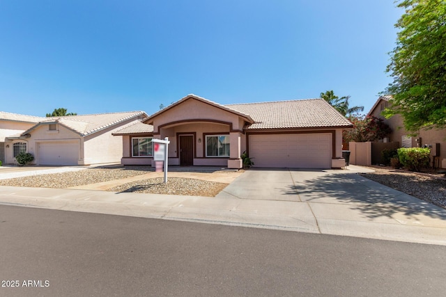 821 E Chicago St, Chandler, AZ 85225 - ranch-style home with concrete driveway, a garage, a tile roof, and stucco siding