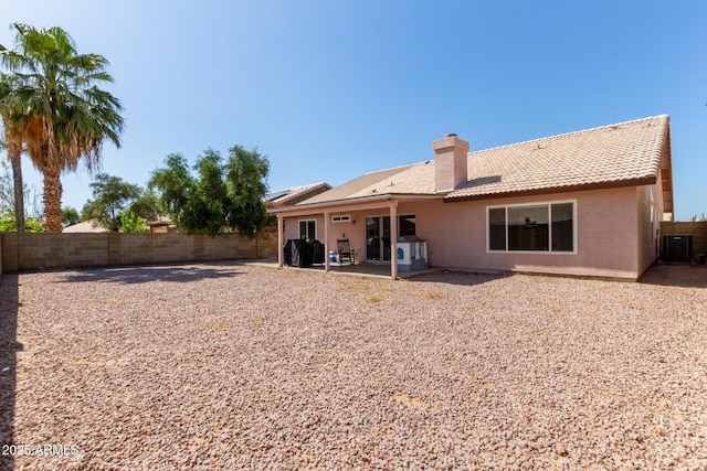 821 E Chicago St, Chandler, AZ 85225 - rear view of house featuring a tiled roof, a chimney, a patio area, a fenced backyard, and stucco siding