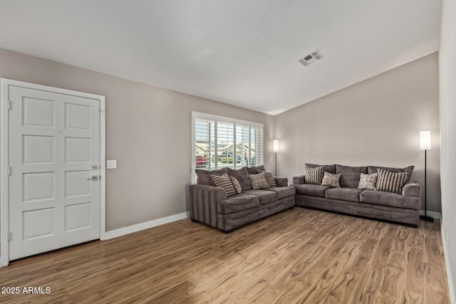 821 E Chicago St, Chandler, AZ 85225 - living room featuring baseboards, light wood-style flooring, and visible vents