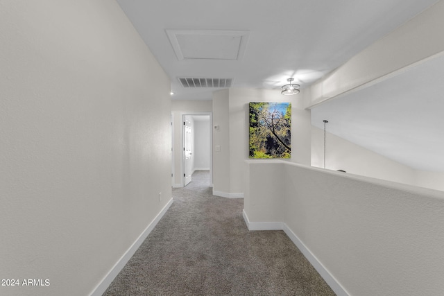 hallway with carpet floors