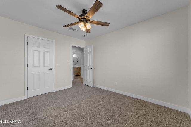 unfurnished bedroom featuring ceiling fan and carpet flooring