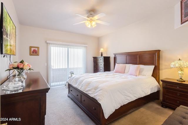 carpeted bedroom featuring access to exterior and ceiling fan