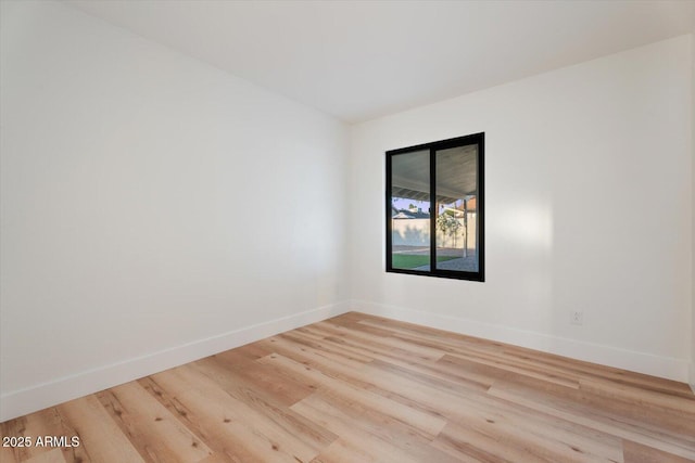 6228 E Blanche Dr, Scottsdale, AZ 85254 - unfurnished room with baseboards and light wood-style floors