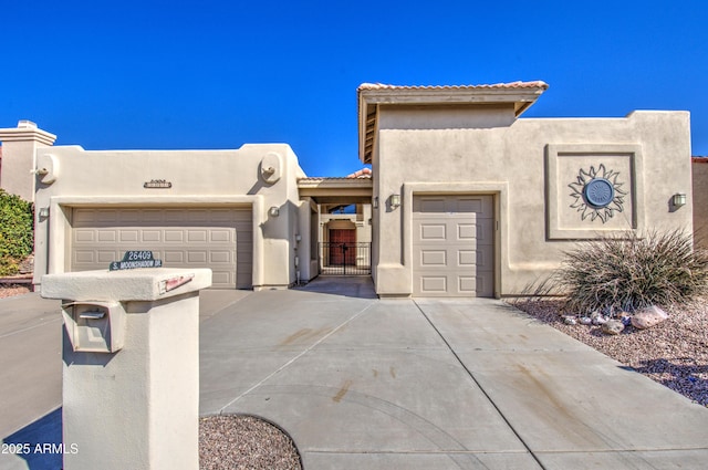 southwest-style home with a garage