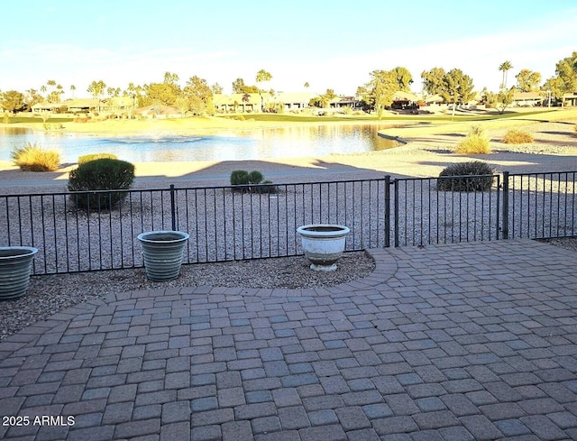 view of patio featuring a water view