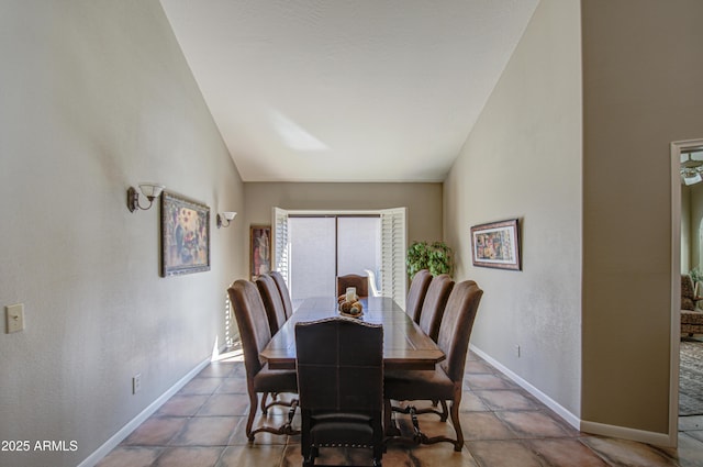 dining space with lofted ceiling