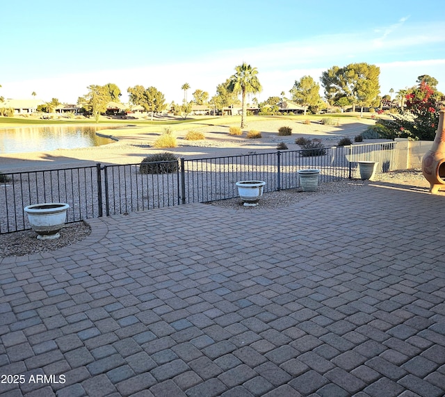 view of patio featuring a water view