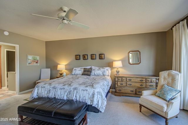 bedroom with light carpet and ceiling fan