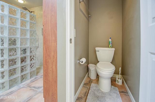 bathroom with a shower and toilet