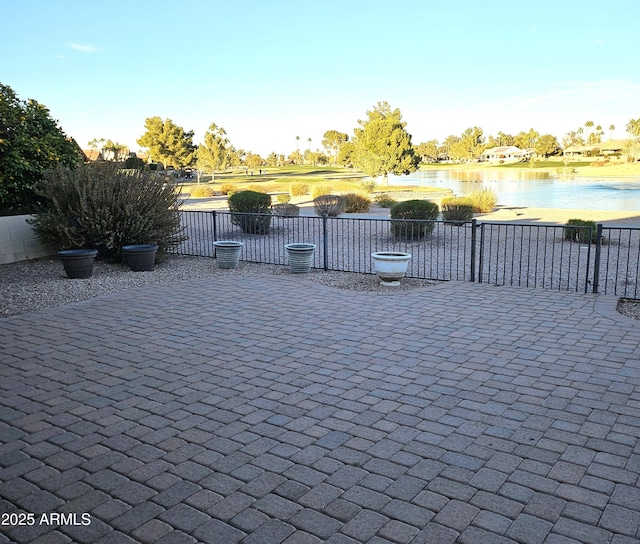 view of patio featuring a water view